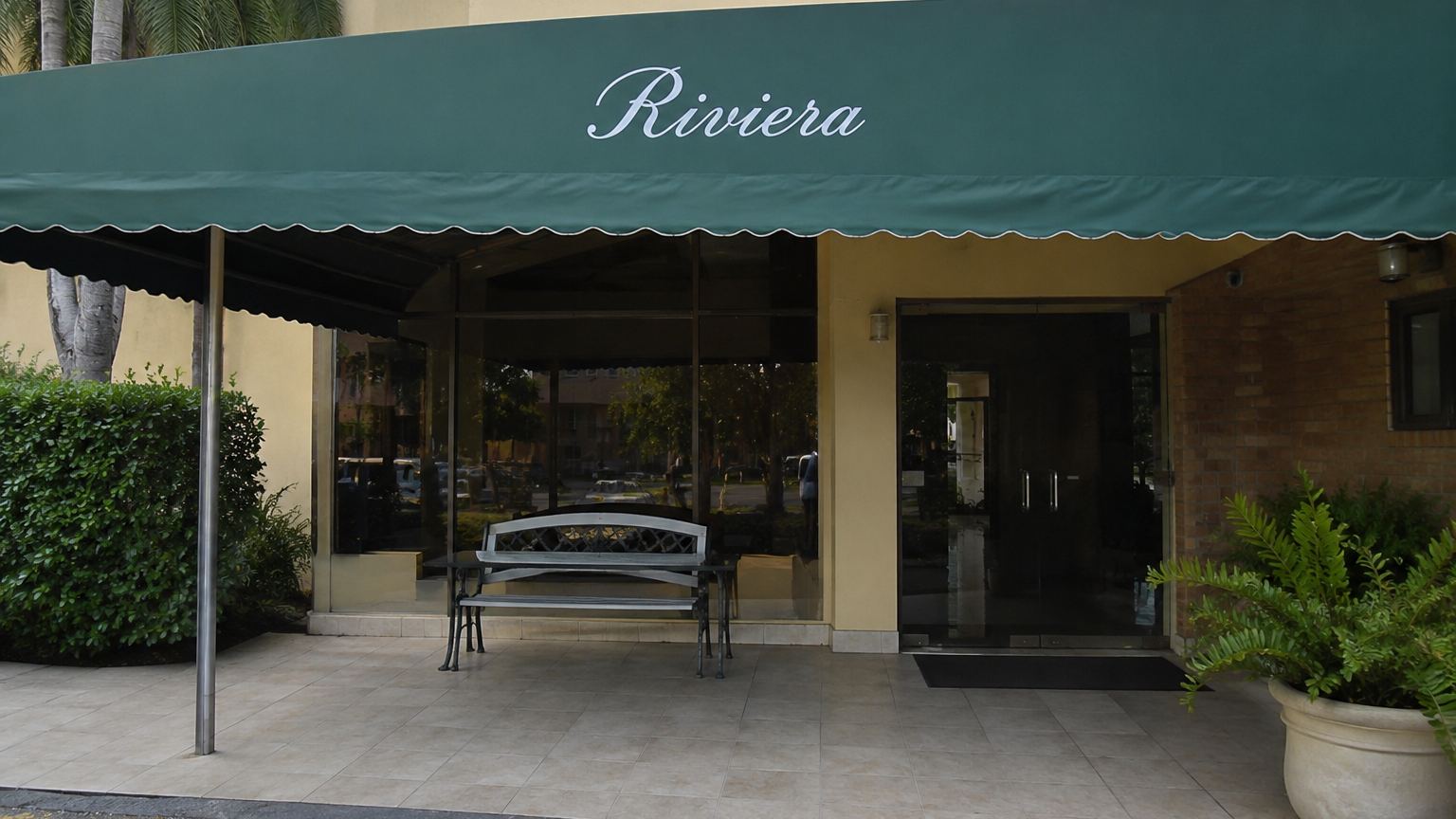 Building entrance under a green awning
